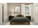 Bright bedroom with white walls, black side tables, a black bed frame, and a patterned rug at 9376 Gladsome Dr, Land O Lakes, FL 34637