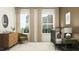 Neutral Bedroom with a crib and windows with natural light, chair, chest of drawers, and patterned rug at 9376 Gladsome Dr, Land O Lakes, FL 34637