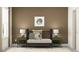 Well-lit Bedroom with brown accent wall, picture frame, patterned rug, crib, and green side tables at 9376 Gladsome Dr, Land O Lakes, FL 34637