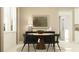 Cozy dining area with modern table, chairs, and natural light at 9376 Gladsome Dr, Land O Lakes, FL 34637