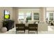 Well-lit living room with comfortable seating, modern furniture and view to the backyard at 9376 Gladsome Dr, Land O Lakes, FL 34637