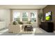 Comfortable living room featuring a sectional sofa, modern furniture and a TV at 9376 Gladsome Dr, Land O Lakes, FL 34637