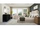 This main bedroom suite offers a peaceful retreat with large windows and a sitting area for relaxation at 9376 Gladsome Dr, Land O Lakes, FL 34637