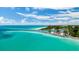Aerial view of a beautiful coastline with sandy beaches and clear turquoise waters at 984 Chickadee Dr, Venice, FL 34285