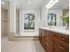 Bathroom featuring a soaking tub and vanity at 984 Chickadee Dr, Venice, FL 34285