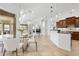 Open concept kitchen featuring granite countertops and a view into a cozy living area at 984 Chickadee Dr, Venice, FL 34285