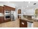 Modern kitchen area featuring stainless steel appliances, granite countertops, and modern lighting at 984 Chickadee Dr, Venice, FL 34285