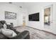 Cozy media room with television and access to the outdoor lanai at 984 Chickadee Dr, Venice, FL 34285