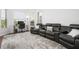 A carpeted room with wall-to-wall seating, perfect for movie nights and relaxation at 984 Chickadee Dr, Venice, FL 34285