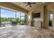 Outdoor patio featuring tile flooring, ceiling fan, wet bar, and grill at 984 Chickadee Dr, Venice, FL 34285