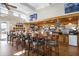 Restaurant with full bar, tables, chairs, and TV screens showing sports at 984 Chickadee Dr, Venice, FL 34285