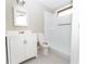This bathroom features a white vanity and shower with a neutral color scheme at 9834 Miramar St, New Port Richey, FL 34654