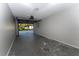 The garage features an automatic door and ample space for vehicles and storage at 9834 Miramar St, New Port Richey, FL 34654