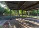 Enjoy the outdoors on this expansive covered patio, perfect for relaxing and entertaining with views of the fenced yard at 9834 Miramar St, New Port Richey, FL 34654