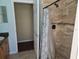 Bathroom with an open shower and a decorative curtain at 9127 Woodridge Run Dr, Tampa, FL 33647