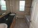 Bathroom with a vanity, toilet and a window at 9127 Woodridge Run Dr, Tampa, FL 33647
