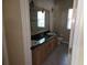 Bathroom featuring a double vanity with granite counters at 9127 Woodridge Run Dr, Tampa, FL 33647