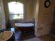 The large bathtub is a highlight of the bathroom, set by a sunny window at 9127 Woodridge Run Dr, Tampa, FL 33647