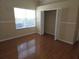 Bedroom with a closet and window offering natural light at 9127 Woodridge Run Dr, Tampa, FL 33647