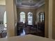 Dining room featuring wood table, china cabinet, chandelier, and hardwood flooring at 9127 Woodridge Run Dr, Tampa, FL 33647
