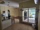 Spacious kitchen with stainless steel appliances, breakfast bar, and seamless access to the lanai at 9127 Woodridge Run Dr, Tampa, FL 33647
