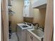 Efficient laundry room featuring washer, dryer, sink, and ample storage space at 9127 Woodridge Run Dr, Tampa, FL 33647
