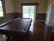 Large living room with pool table and lanai access at 9127 Woodridge Run Dr, Tampa, FL 33647
