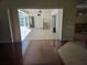 Spacious living room with sliding doors that open to the screened-in pool area at 9127 Woodridge Run Dr, Tampa, FL 33647