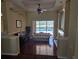 Elegant living room with hardwood floors, fireplace, and view of pool at 9127 Woodridge Run Dr, Tampa, FL 33647