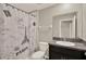Bathroom featuring a shower-tub, vanity, mirror and decorative shower curtain at 1015 7Th Nw Ave, Ruskin, FL 33570