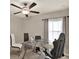 The office features a ceiling fan, bright light, and furniture and equipment perfect for a work-from-home lifestyle at 1015 7Th Nw Ave, Ruskin, FL 33570