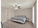 A spacious bedroom featuring a queen bed, ceiling fan, and carpet flooring at 1015 7Th Nw Ave, Ruskin, FL 33570