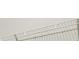 White wire shelving unit in a closet providing ample storage at 1015 7Th Nw Ave, Ruskin, FL 33570