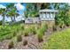 Shell Cove entrance sign surrounded by lush landscaping and greenery at 1015 7Th Nw Ave, Ruskin, FL 33570