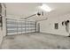 Spacious two car garage with concrete flooring at 1015 7Th Nw Ave, Ruskin, FL 33570