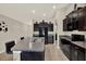 The kitchen features dark cabinets, granite countertops, stainless steel appliances, and a breakfast bar with seating at 1015 7Th Nw Ave, Ruskin, FL 33570