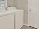 Bright laundry room with white washer and dryer at 1015 7Th Nw Ave, Ruskin, FL 33570