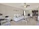 Open-concept living area features modern decor, tile flooring, and a sleek wet bar, perfect for entertaining at 1015 7Th Nw Ave, Ruskin, FL 33570