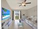 Relaxing living room with lake views and a cozy white couch, perfect for entertainment at 1015 7Th Nw Ave, Ruskin, FL 33570