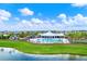 Stunning community pool featuring beach entry, sun loungers and chairs, and meticulously kept green space at 1015 7Th Nw Ave, Ruskin, FL 33570