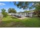 A backyard with a patio featuring a brick surface and outdoor seating at 1035 58Th N Ave, St Petersburg, FL 33703