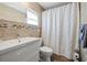 Bathroom with shower, tiled walls, and modern vanity at 1035 58Th N Ave, St Petersburg, FL 33703