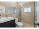 Contemporary bathroom featuring a glass-enclosed shower, stylish vanity, and tiled flooring at 1035 58Th N Ave, St Petersburg, FL 33703