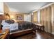 Bright bedroom features hardwood floors, a large bed, and neutral decor at 1035 58Th N Ave, St Petersburg, FL 33703