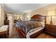 Charming bedroom featuring wood floors, a large bed, and mirrored closet doors at 1035 58Th N Ave, St Petersburg, FL 33703