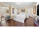 Bedroom with hardwood floors, closet, overhead lighting, and a large bed at 1035 58Th N Ave, St Petersburg, FL 33703
