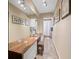 Hallway with wooden floors, wall art, and lighting at 1035 58Th N Ave, St Petersburg, FL 33703