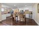 Kitchen features a kitchen island, bar stool seating, white cabinets, and stainless steel appliances at 1035 58Th N Ave, St Petersburg, FL 33703