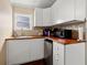 Kitchen featuring white cabinetry, a mini-fridge, wood countertop, and under-cabinet lighting at 1035 58Th N Ave, St Petersburg, FL 33703
