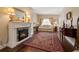 Elegant living room featuring a fireplace, hardwood floors, and neutral decor with ornate accents at 1035 58Th N Ave, St Petersburg, FL 33703